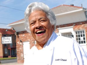 Chef Leah Chase stands outside her famous Creole restaurant, Dookie Chase's, which was flooded out during Hurricane Katrina, on March 9, 2007, in New Orleans.